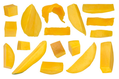 Pieces of ripe mango cut into slices on a white isolated background. Ripe mango from different sides and different ways of cutting. High quality photo.の写真素材