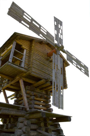 Wooden old windmill isolated over white.の写真素材