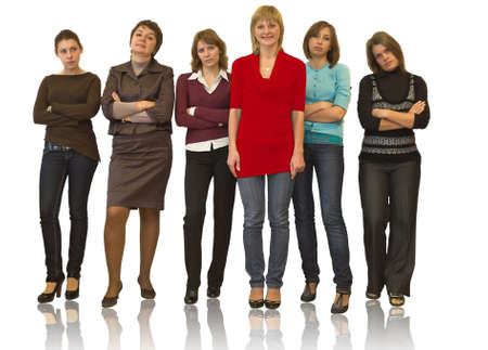 Six beautiful models a women stand on white background in studio. Full-length portrait. Five are in a melancholy mood. One in red dress.の写真素材