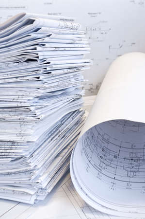 Heap of project drawings on a tableの写真素材