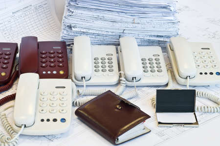 Several phones near design drawings. Call centerの写真素材