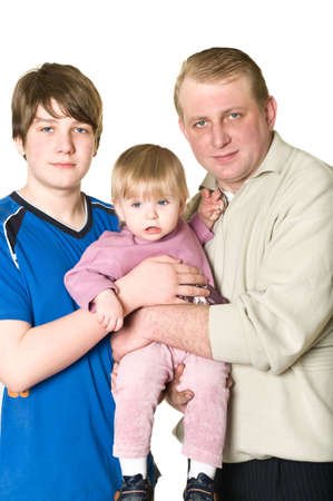 Portrait of father with two children: teenage boy and little girl. Men holding a girl. Isolated on white backgroundの写真素材