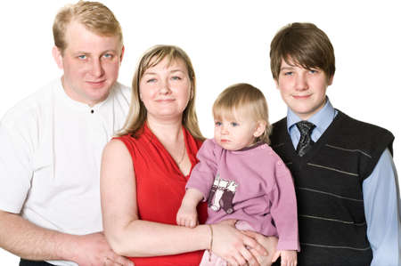 Studio portrait of happy blond family sitting on sofa. Isolated on white background. Four peopleの写真素材