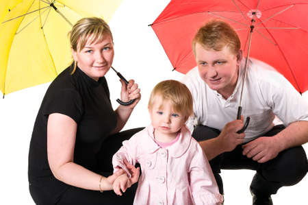 Family of three with baby. Happy young family isolated over white backgroundの写真素材