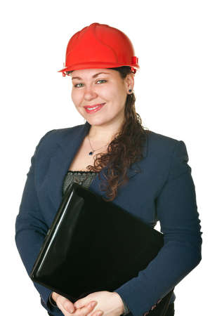 Young woman architect in red helmet and with laptop. Isolated on white backgroundの写真素材