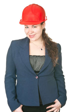 The beautiful woman architect in red helmet. Isolated on white backgroundの写真素材