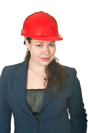 The beautiful woman architect in red helmet. Isolated on white backgroundの写真素材