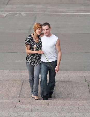 Young loving couple teens. Two Caucasian people. Teenagers: girl and boy embracing one anotherの写真素材