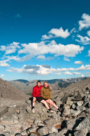Father and son on peak of mountain. Two people familyの写真素材
