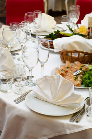 Elegant banquet and dinner tables prepared for a holiday or a party.の写真素材