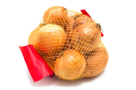 Onions packing in mesh. Isolated on white backgroundの写真素材