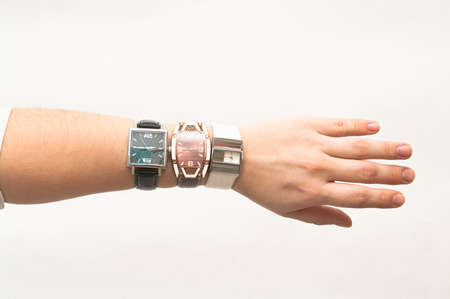 Several elegant wristwatches on the handの写真素材