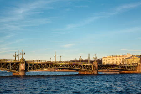 Trinity bridge across the river Neva, Russia, St. Petersburg. Blue sky with cloudsの写真素材