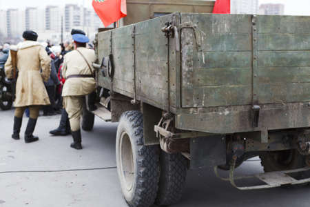 SAINT-PETERSBURG, RUSSIA - NOVEMBER 4: Military performance in celebration of National Unity Day. Three soviet soldiers standing near army lorry on November 4, 2011 in Saint-Petersburg, Russia.のeditorial素材