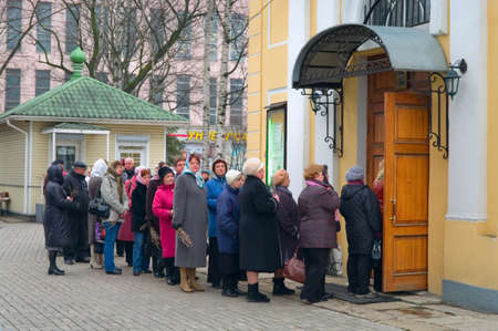  SAINT-PETERSBURG, RUSSIA - APRIL 12: Queue from old people in the church in Easter Sunday on April 12, 2011 in Saint-Petersburg, Russia.のeditorial素材