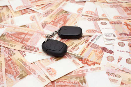 Car key on money cashnotes backgroundの写真素材
