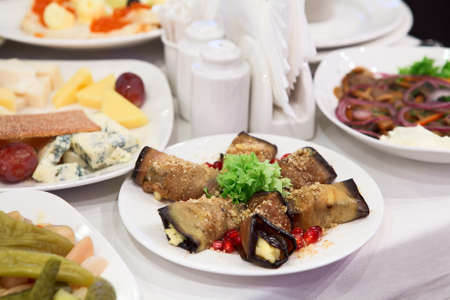 Table appointments with snacks. Plate with fork and knife