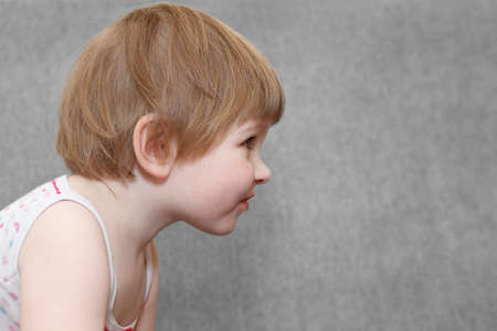 Portrait of small girl in profile with copy spaceの写真素材