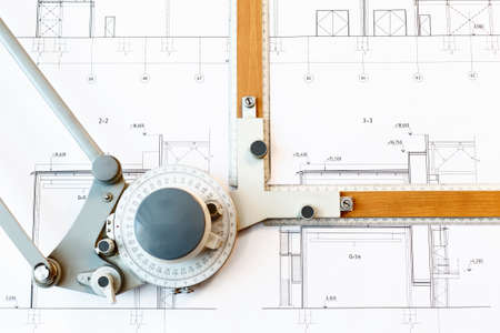 Old-fashioned drawing board with white project blueprintの写真素材
