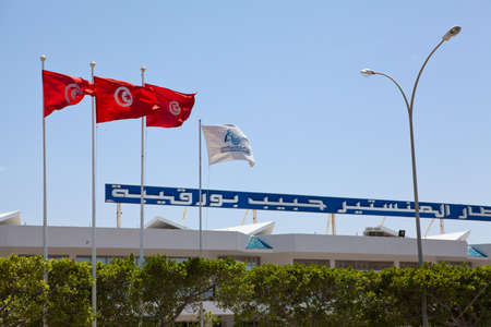 MONASTIR, TUNISIA - CIRCA APRIL, 2012: Close up of flags on building of Habib Bourguiba International airport on circa April, 2012 in Monastir, Tunisiaのeditorial素材