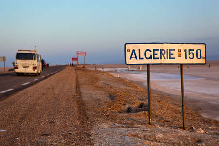 TUNISIA - CIRCA MAY 2012: Road through the salt lake Chott el Djerid  from the Tunisia to Algeria in the early morning on circa May 2012, Tunisiaのeditorial素材