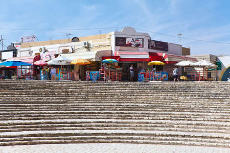 EL DJEM, TUNISIA - CIRCA MAY, 2012: Tunisian amphitheater in El Djem, Tunisia. Entrance area with small townのeditorial素材