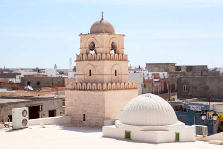 TUNISIA - CIRCA MAY, 2012: Minaret of small Arabic Tunisian mosque in province town, on circa May, 2012 in Tunisia.のeditorial素材