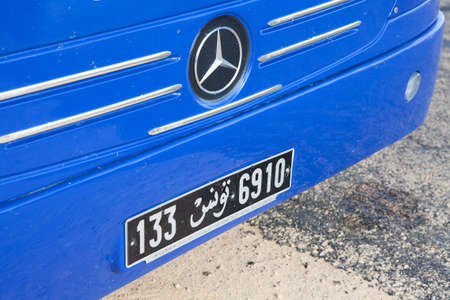 MONASTIR, TUNISIA - CIRCA MAY, 2012: Tunisian license plate on the front of blue bus Mercedes on circa May, 2012 in Monastir, Tunisia.のeditorial素材