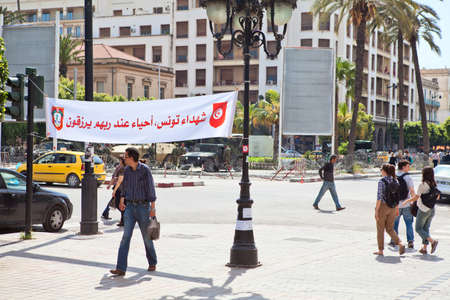 TUNIS, TUNISIA - CIRCA MAY, 2012: Main avenue Habib Bourguiba in Tunis capital with strike poster, on circa May, 2012 in Tunis, Tunisia.のeditorial素材
