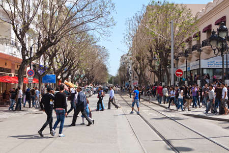 TUNIS, TUNISIA - CIRCA MAY, 2012: Many people on Tunis capital streets going in different ways, on circa May, 2012 in Tunis, Tunisia.のeditorial素材