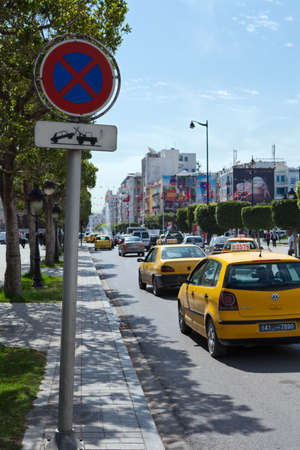 TUNIS, TUNISIA - CIRCA MAY, 2012: Sign of parking and stopping is prohibited on the sidewalk with evacuator image, Habib Bourguiba avenue, on circa May, 2012 in Tunis, Tunisia.のeditorial素材