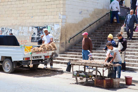 SOUSSE, TUNISIA - CIRCA MAY, 2012: People who sell vegetables on the streets of the city, on circa May, 2012 in Sousse, Tunisia.のeditorial素材