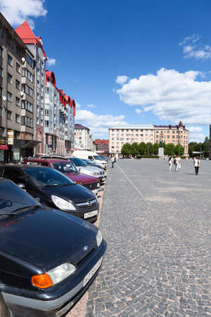 VIBORG, RUSSIA - CIRCA JUNE, 2012: Central square with parking cars and walking area, on circa June, 2012 in Vyborg, Russiaのeditorial素材