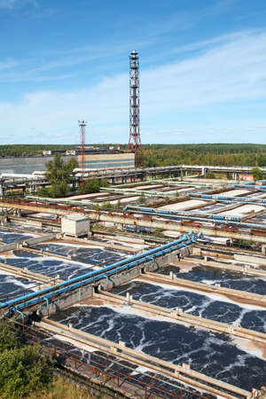 Industrial water treatment plant in evergreen forestsの写真素材