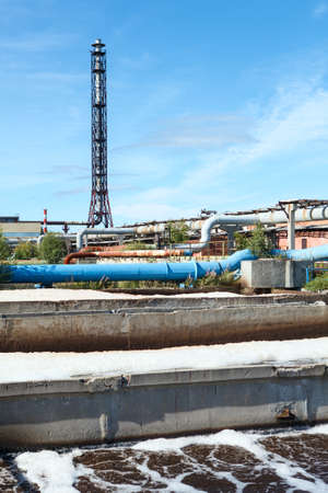 Water treatment plant view with chimney and blue skyの写真素材