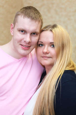 Closeup portrait of a beautiful young couple smiling togetherの写真素材