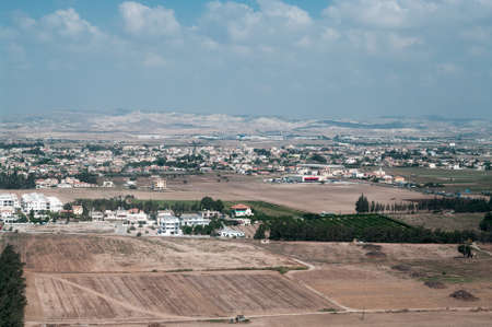 View above of Cypriot settlement near big city in Cyprus islandの写真素材