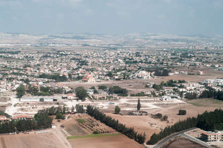 View above of Cypriot settlement near big city in Cyprus islandの写真素材
