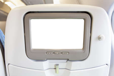 Aircraft monitor in passenger seat isolated on white background の写真素材