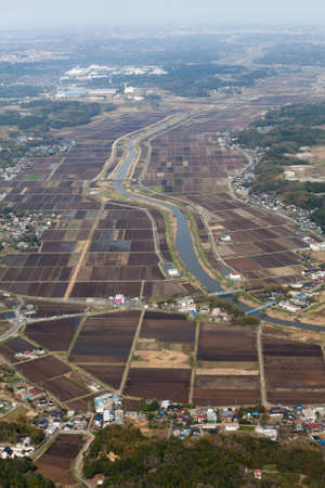 Japanese countryside with rice fields, river and small towns and villages, Japanの写真素材