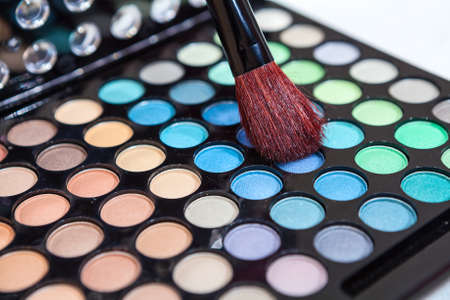 Makeup brush in cosmetic multicolored paletteの写真素材