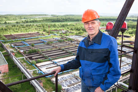 Smiling Caucasian worker standing for high altitude platform  Copyspace