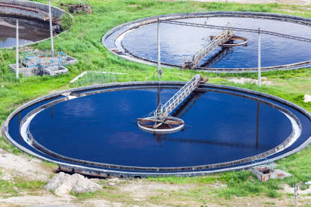 Round owerflowing settlers in treatment plantの写真素材