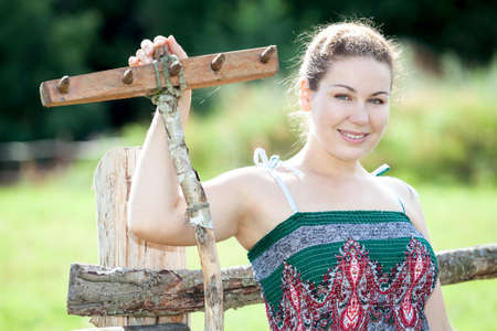 Beautiful smiling young woman in country styleの写真素材