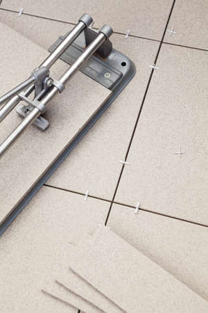 Work of cutting and laying porcelain tilesの写真素材