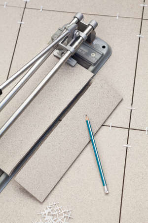 Works on cutting and laying of tileの写真素材