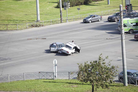 SAINT-PETERSBURG, RUSSIA-AUGUST 16, 2013  Car accident in street intersection on August 16, 2013 in Saint-Petersburg, Russia  Crash between two cars on drive at red traffic light  No one was injuredのeditorial素材