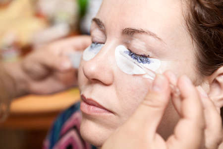 Female eyelash dyeing with permanent makeupの写真素材