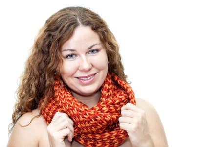 Young woman with naked body with scarf on neck looking at camera の写真素材