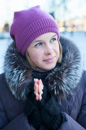Portrait of a beautiful happy girl in winter clothesの写真素材